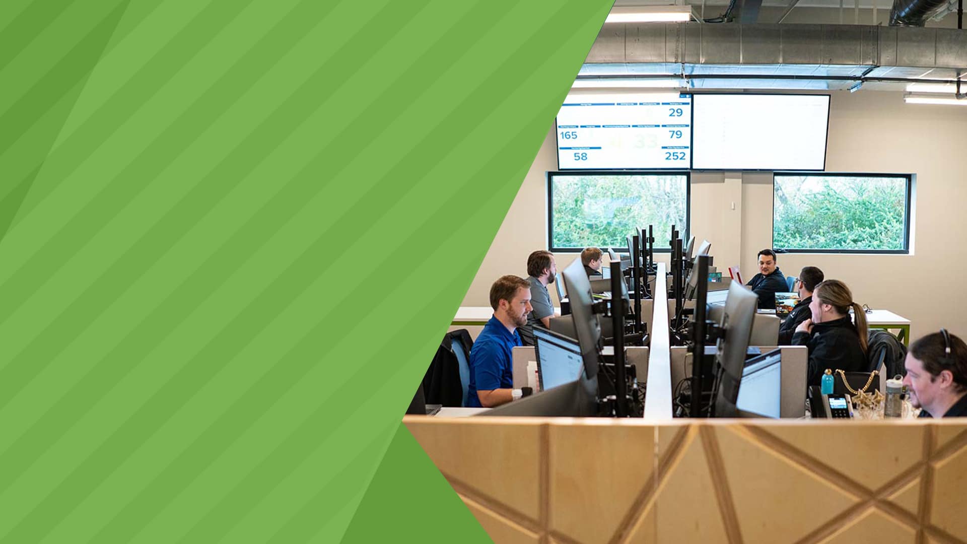 Office workers next to each other working